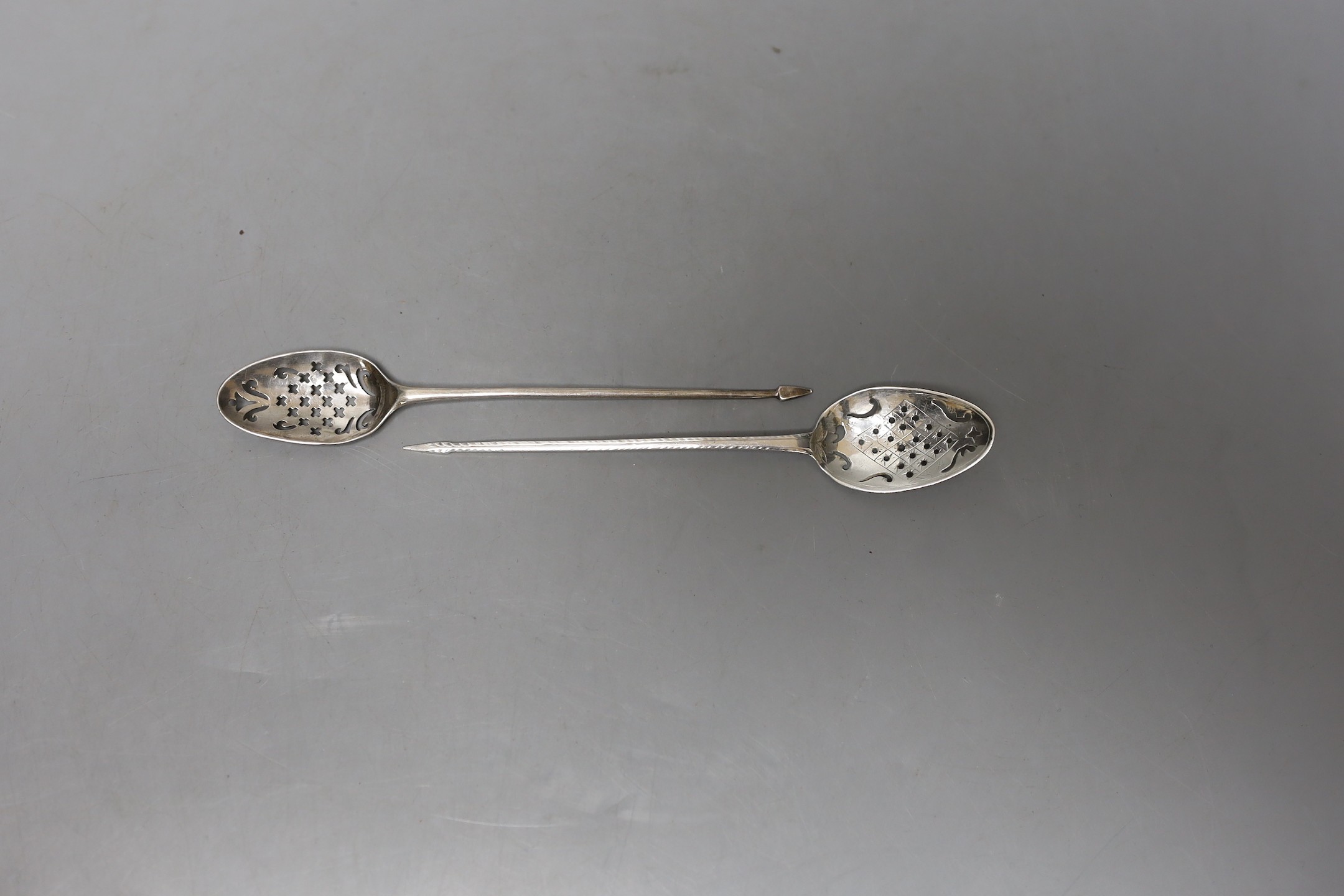 Two 18th century silver mote spoons, one a.f., longest 13.6cm, maker's mark RR for one spoon.